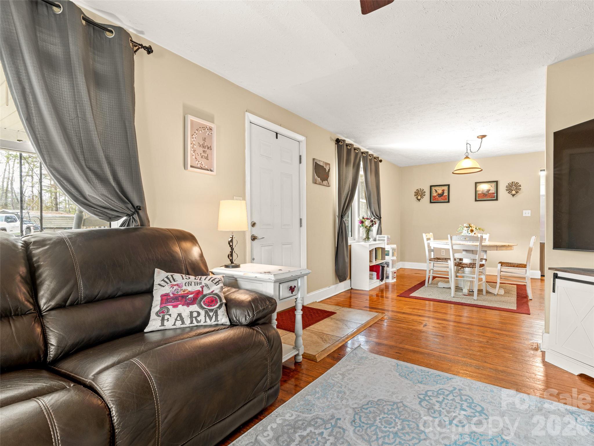 6 Nelson Road Hendersonville, NC 28791 - Photo 5 of 18 a living room with furniture and a large window