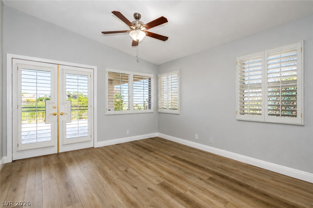 2278 Ramsgate Drive Henderson, NV 89074 - Photo 14 of 34 French doors lead to outdoor leisure from this versatile room with durable laminate flooring and a ceiling fan.