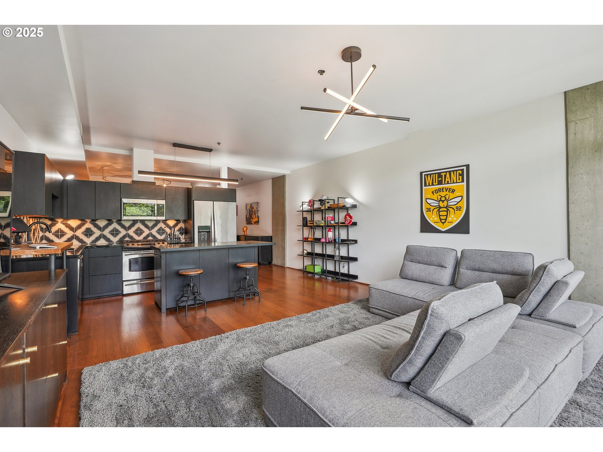 1221 Southwest 10th Avenue, Unit 410 Portland, OR 97205 - Photo 11 of 26 a living room with furniture and a view of kitchen