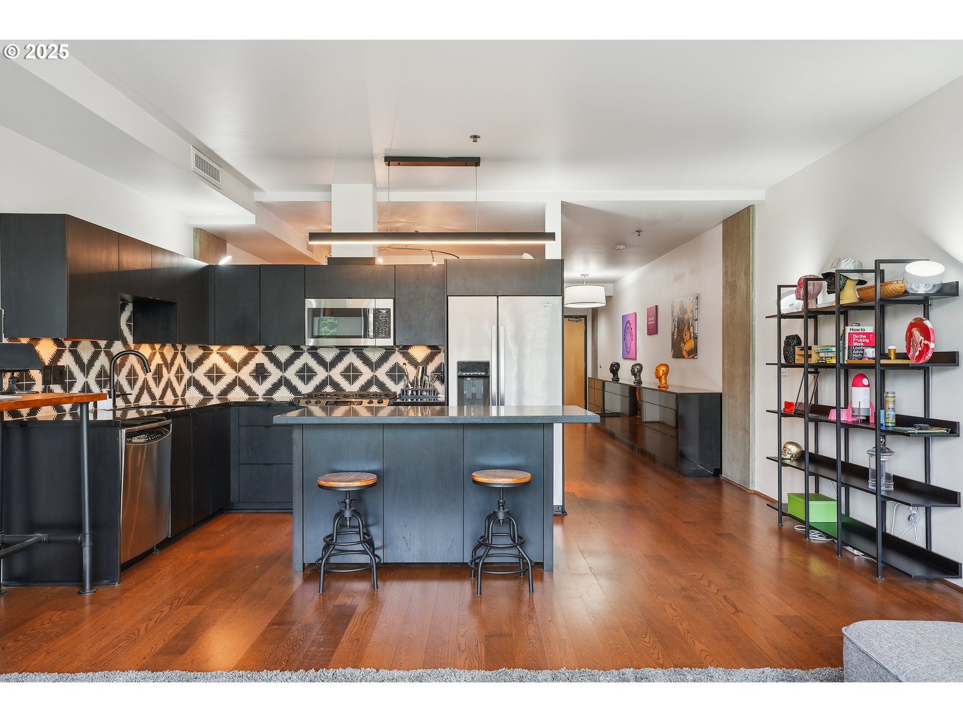 1221 Southwest 10th Avenue, Unit 410 Portland, OR 97205 - Photo 12 of 26 a living room with lots of furniture and a wooden floor