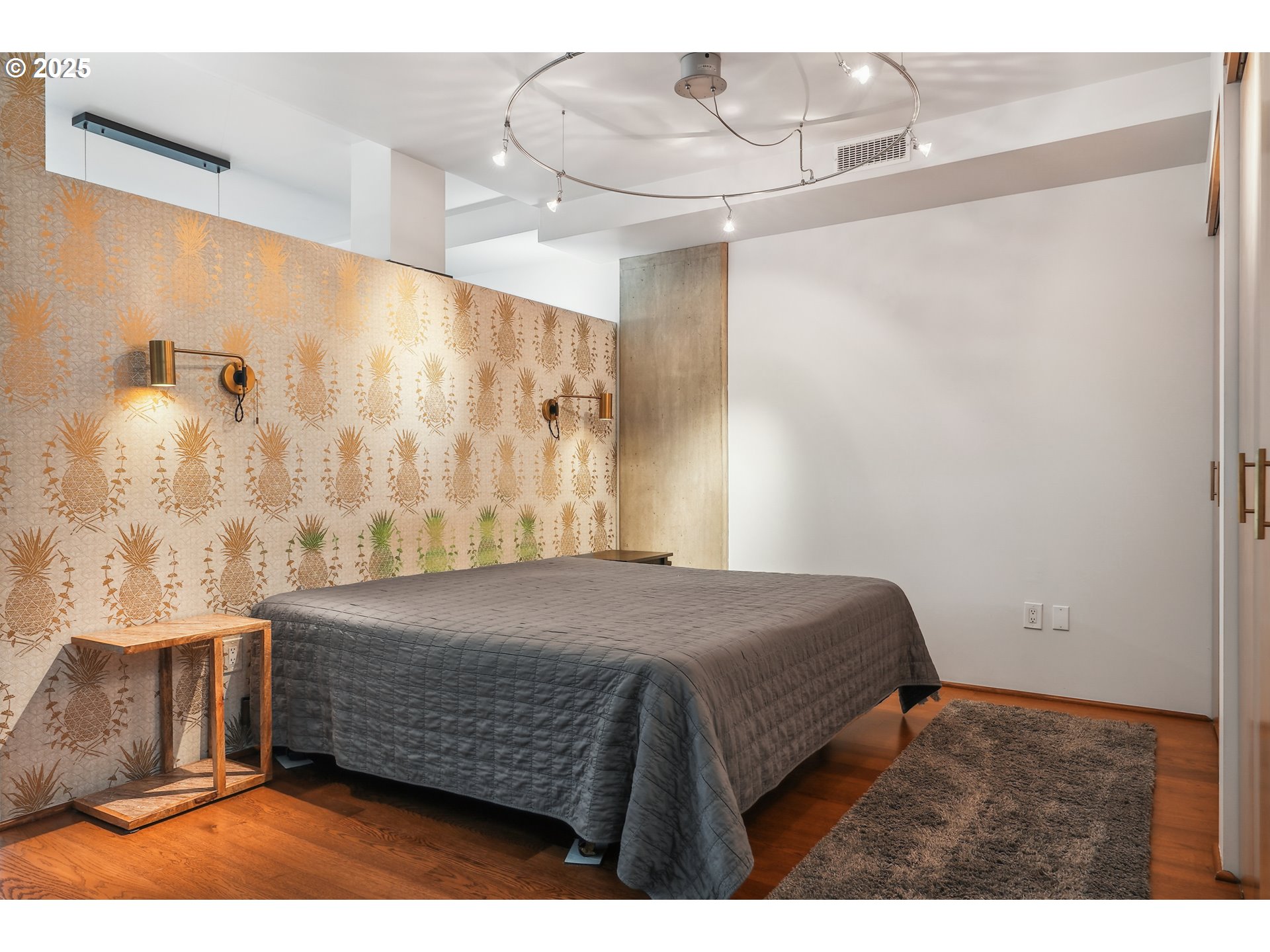 1221 Southwest 10th Avenue, Unit 410 Portland, OR 97205 - Photo 17 of 26 a bedroom with a bed and a table