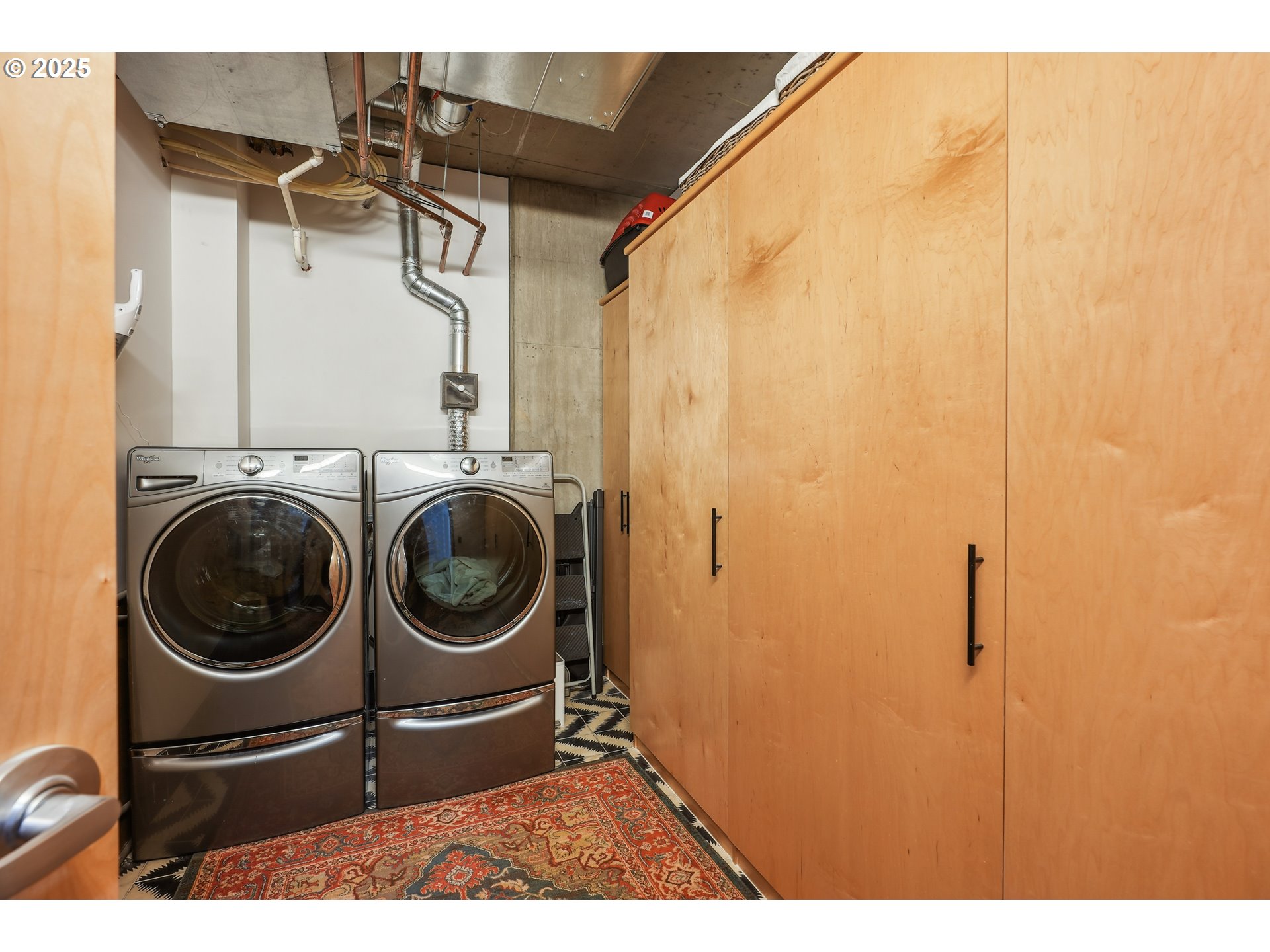 1221 Southwest 10th Avenue, Unit 410 Portland, OR 97205 - Photo 22 of 26 a utility room with sink dryer and washer