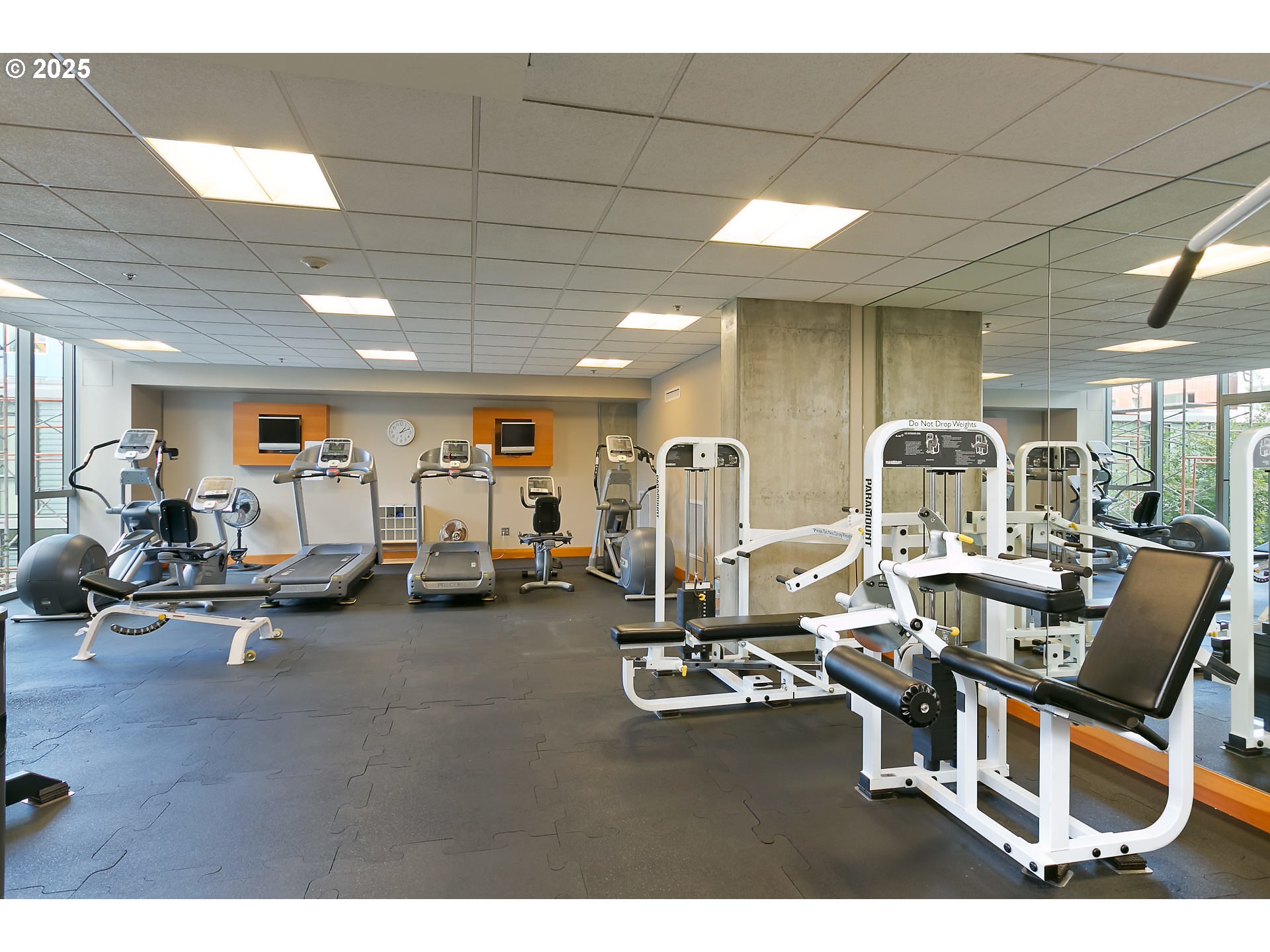 1221 Southwest 10th Avenue, Unit 410 Portland, OR 97205 - Photo 24 of 26 a room with gym equipment and view of living room