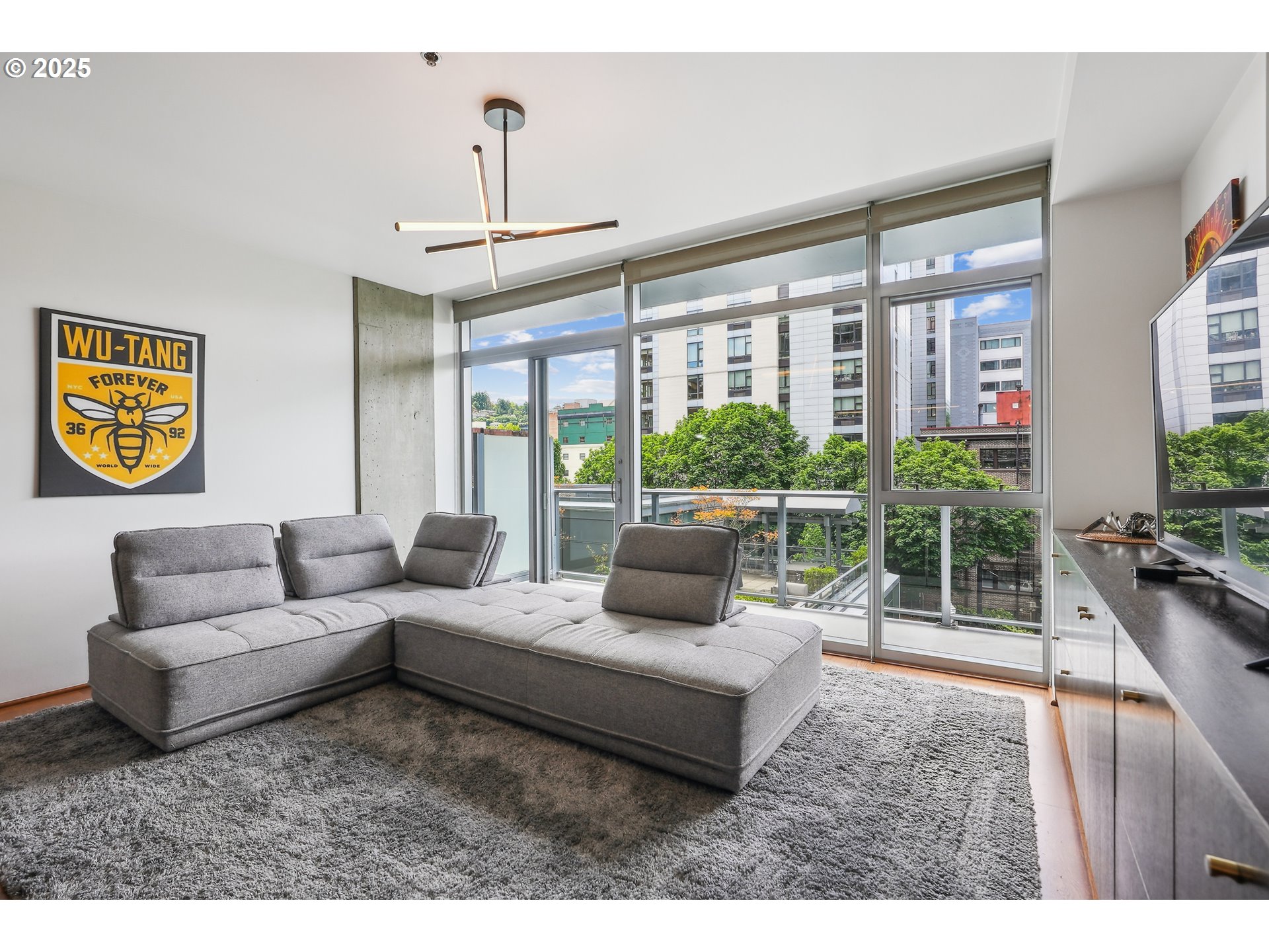 1221 Southwest 10th Avenue, Unit 410 Portland, OR 97205 - Photo 6 of 26 a living room with furniture and a large window