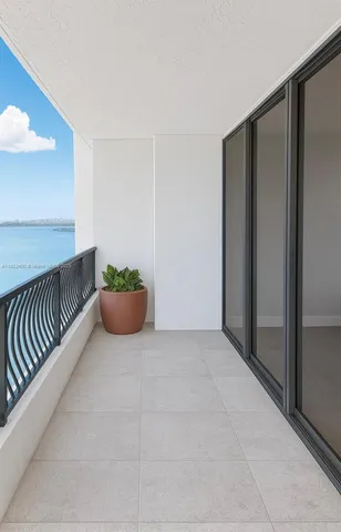 a view of an empty room and a balcony