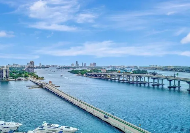 an aerial view of residential building and ocean view