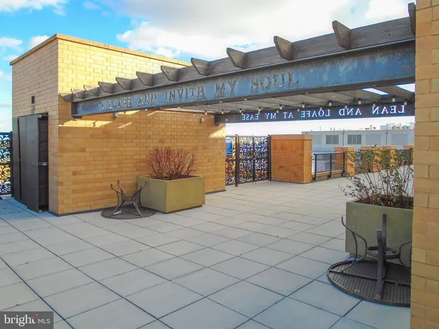 a view of a hallway with paintings on the wall