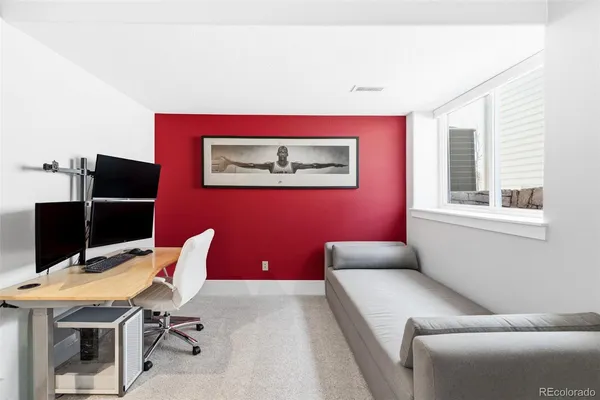 a workspace with furniture and window