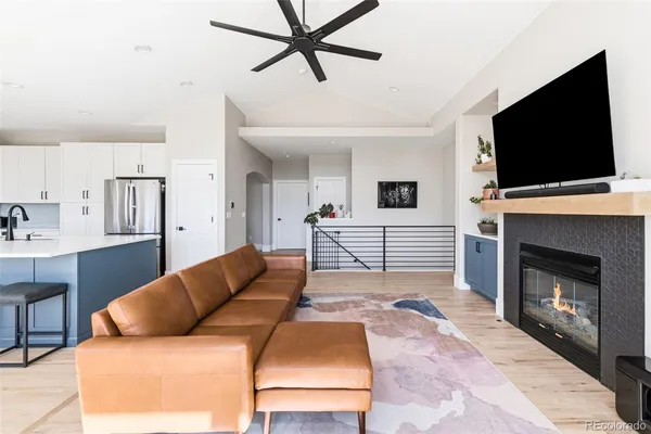 a living room with a flat screen tv and a fireplace