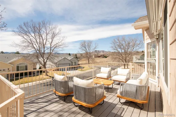 a view of balcony with furniture