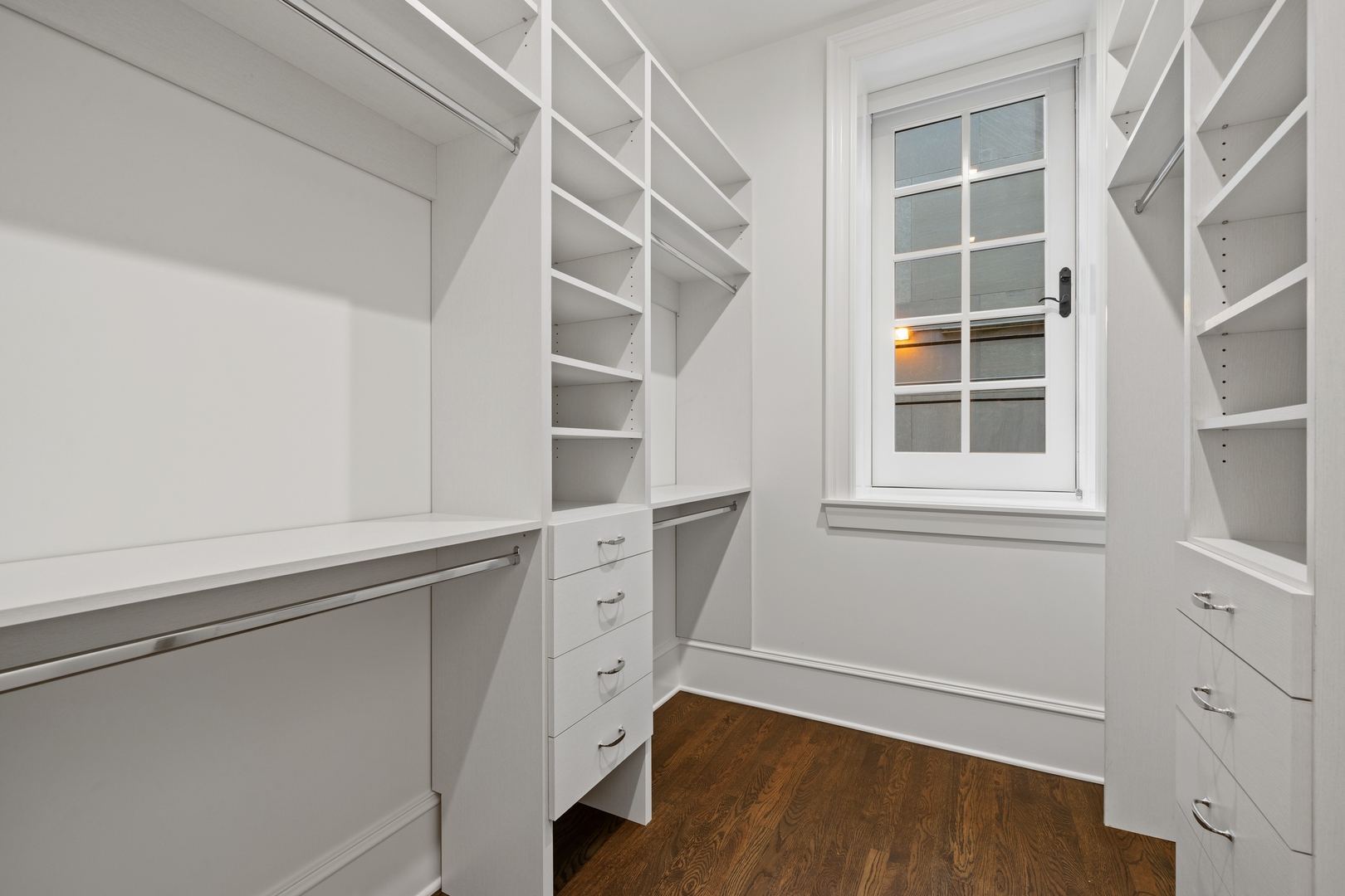 1300 North Ritchie Court, Unit 2 Chicago, IL 60610 - Photo 21 of 25 a view of an empty room with a window and wooden floor