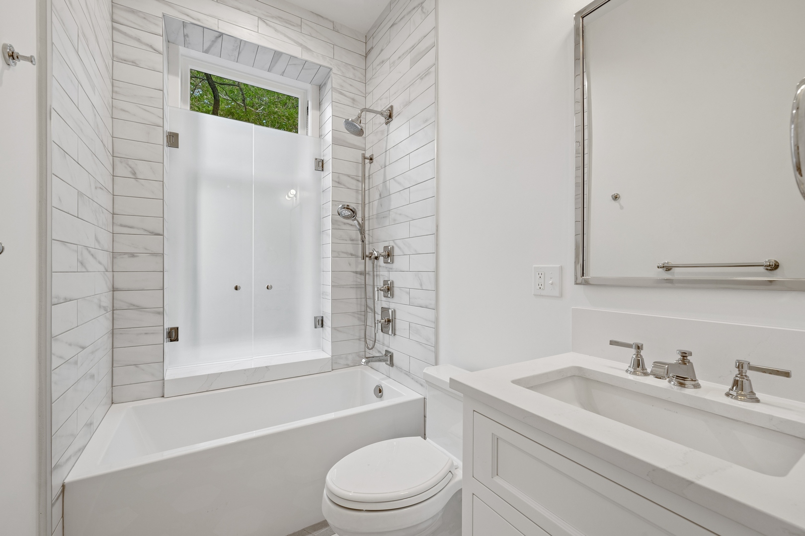 1300 North Ritchie Court, Unit 2 Chicago, IL 60610 - Photo 23 of 25 a bathroom with a granite countertop sink toilet and shower