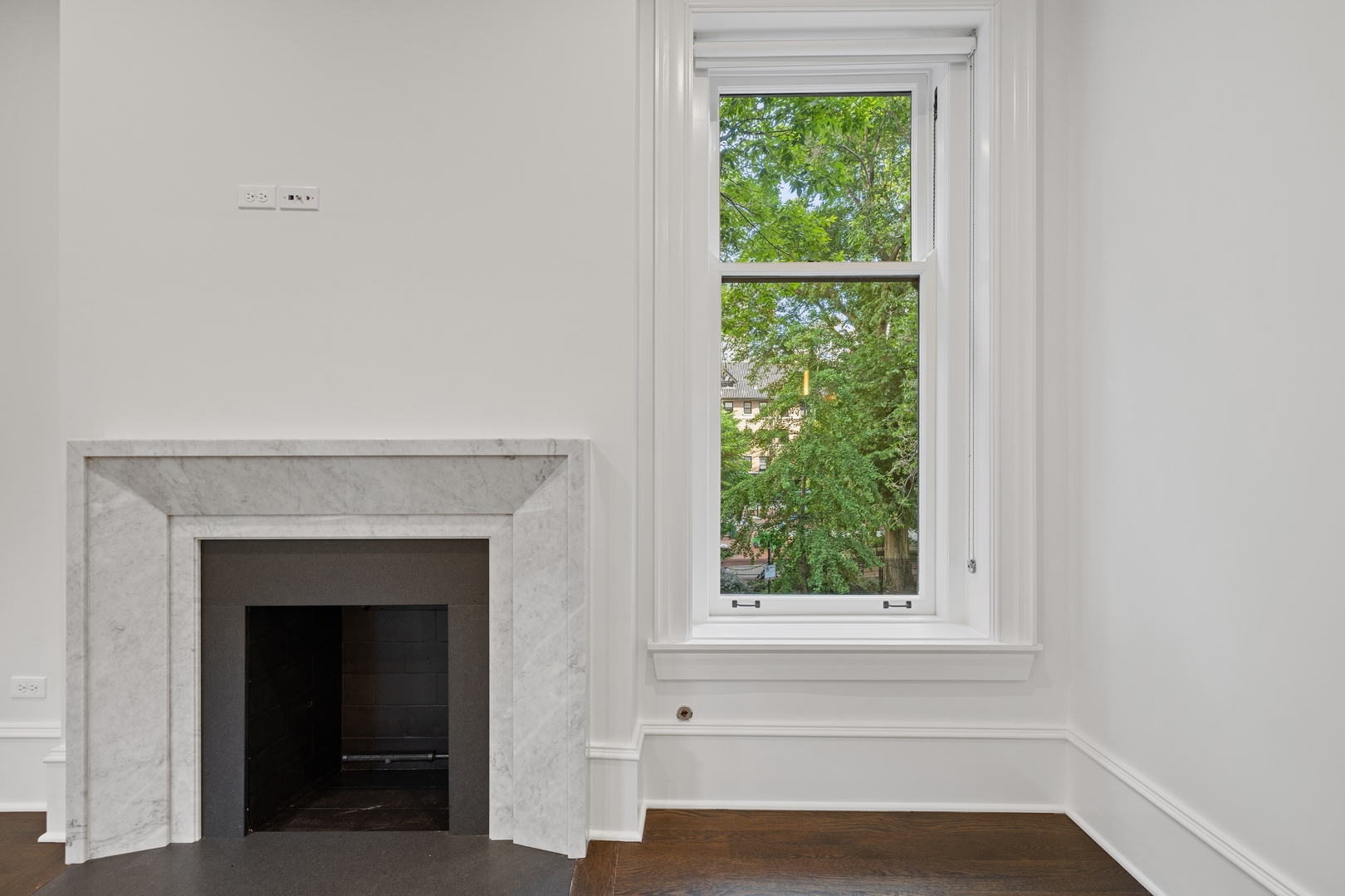 1300 North Ritchie Court, Unit 2 Chicago, IL 60610 - Photo 9 of 25 a view of an empty room with a window