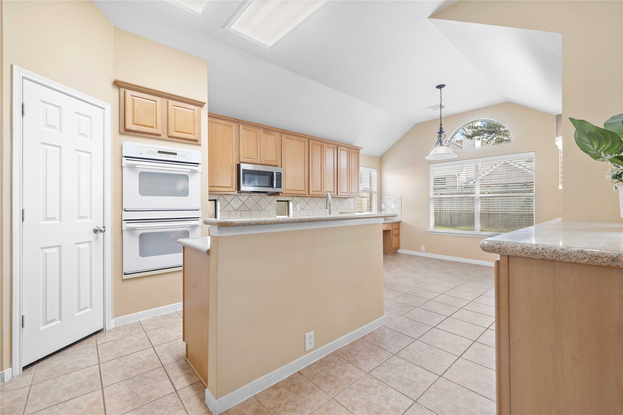 2915 Sandleigh Drive Spring, TX 77388 - Photo 11 of 30 a kitchen with stainless steel appliances granite countertop a refrigerator and a stove top oven