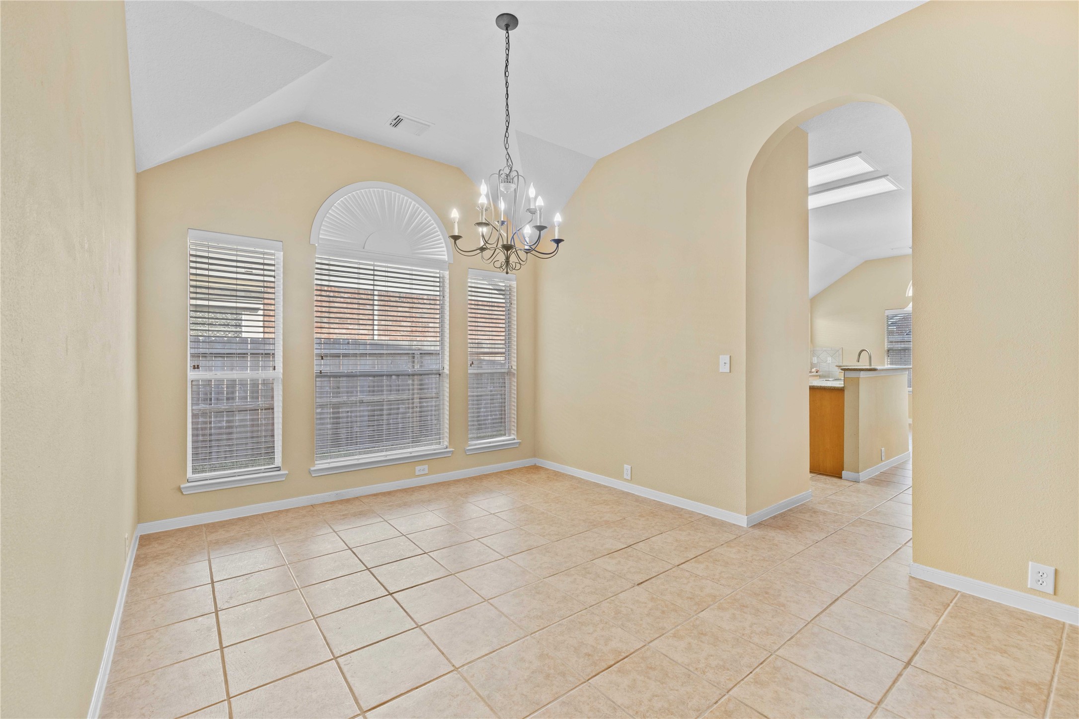 2915 Sandleigh Drive Spring, TX 77388 - Photo 16 of 30 an empty room with chandelier fan and windows