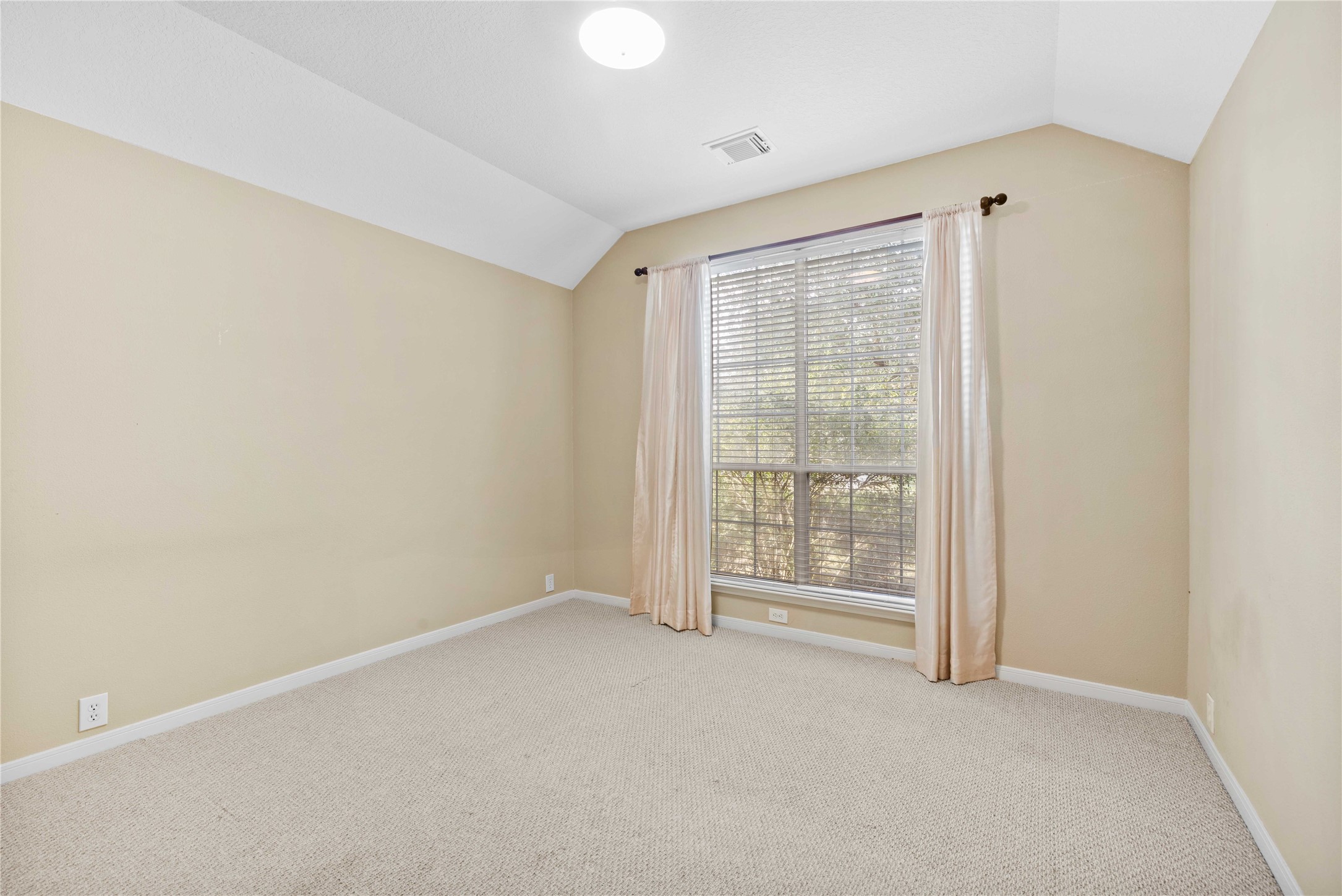 2915 Sandleigh Drive Spring, TX 77388 - Photo 25 of 30 a view of an empty room with a window