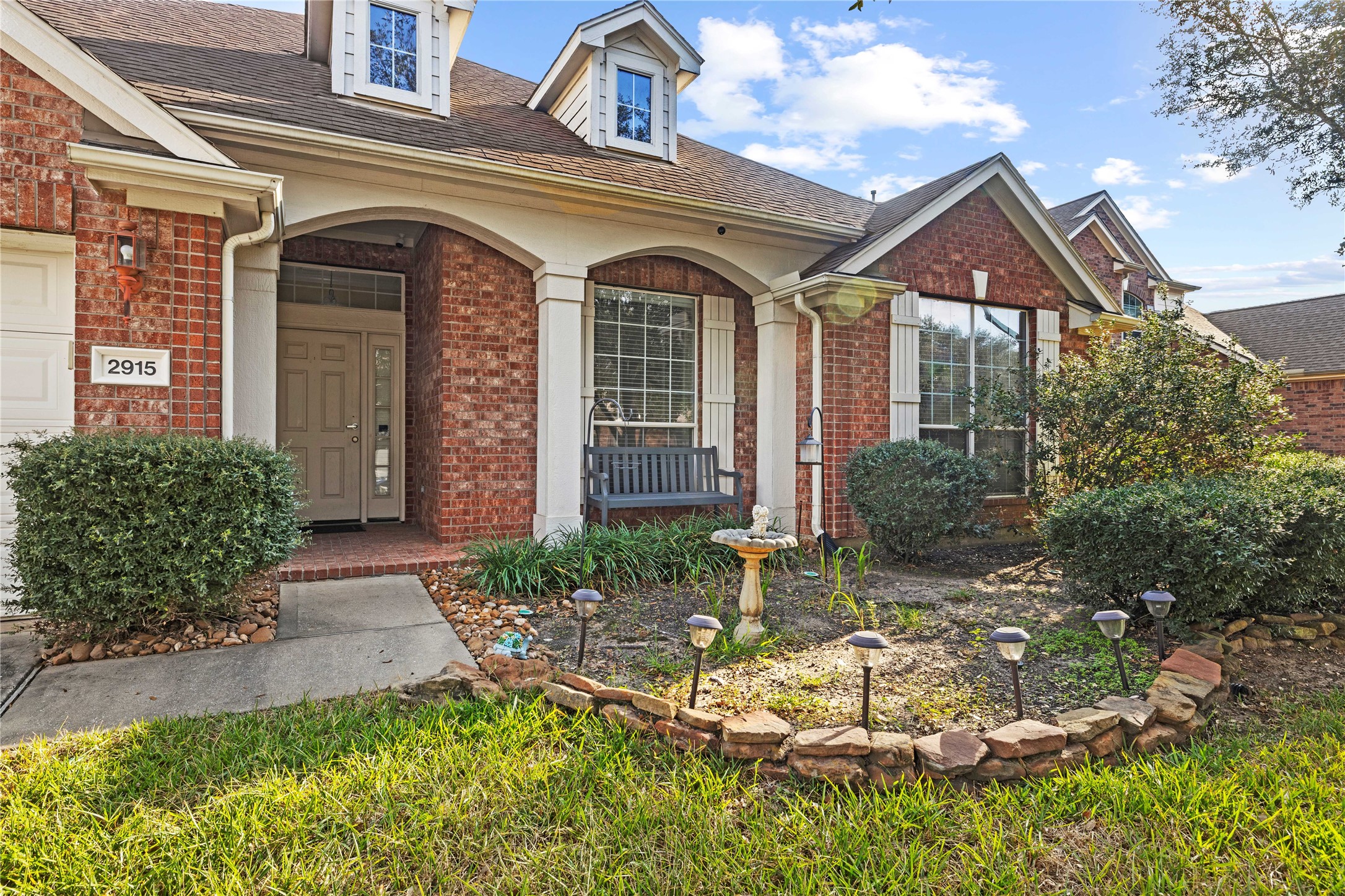 2915 Sandleigh Drive Spring, TX 77388 - Photo 3 of 30 a front view of a house with garden