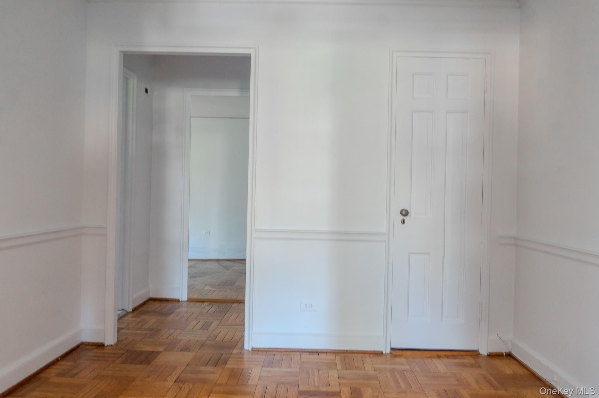 7 Chateaux Circle, Unit 7E Scarsdale, NY 10583 - Photo 11 of 28 view to the kitchen from entryway with the closet on the right side