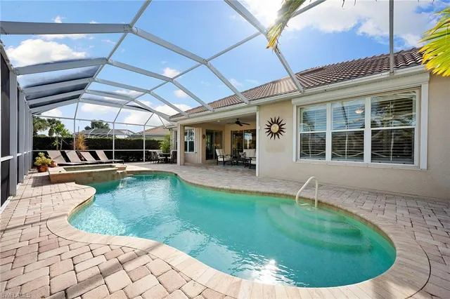 a view of a swimming pool with a patio