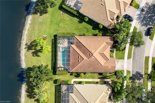 an aerial view of a house with a yard