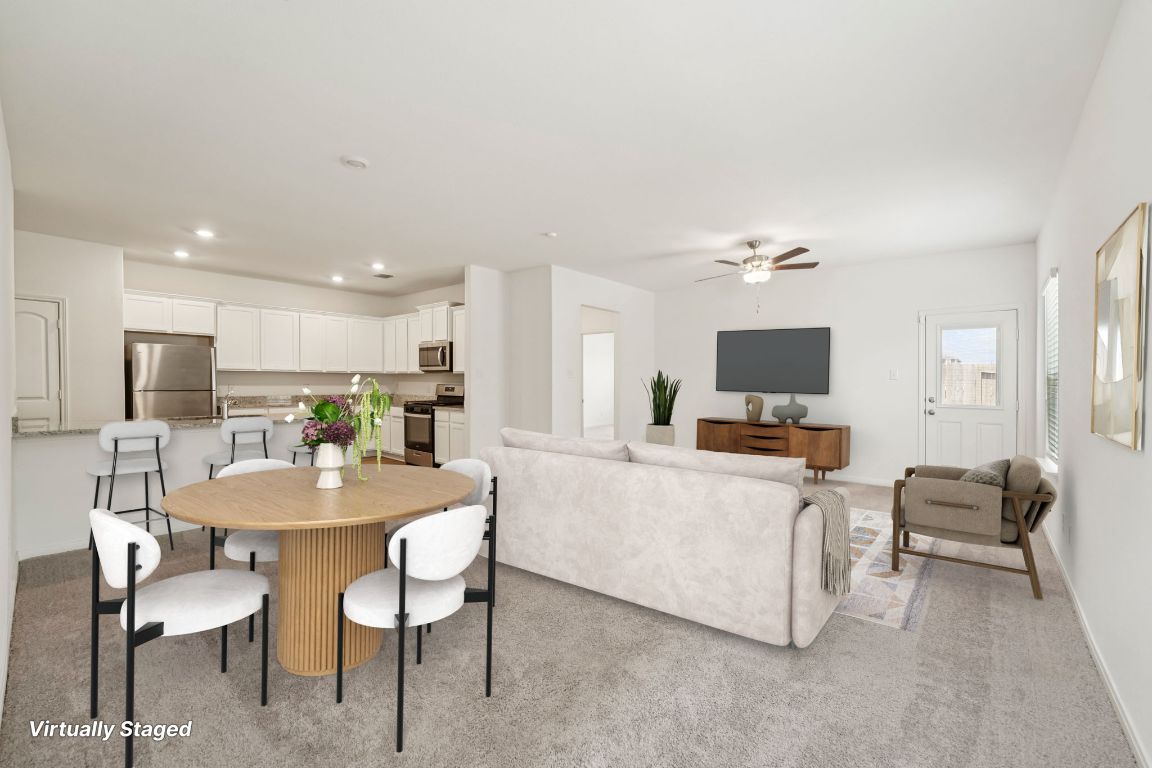 571 Aplite Pass Maxwell, TX 78656 - Photo 13 of 29 a view of a dining room with furniture and a flat screen tv