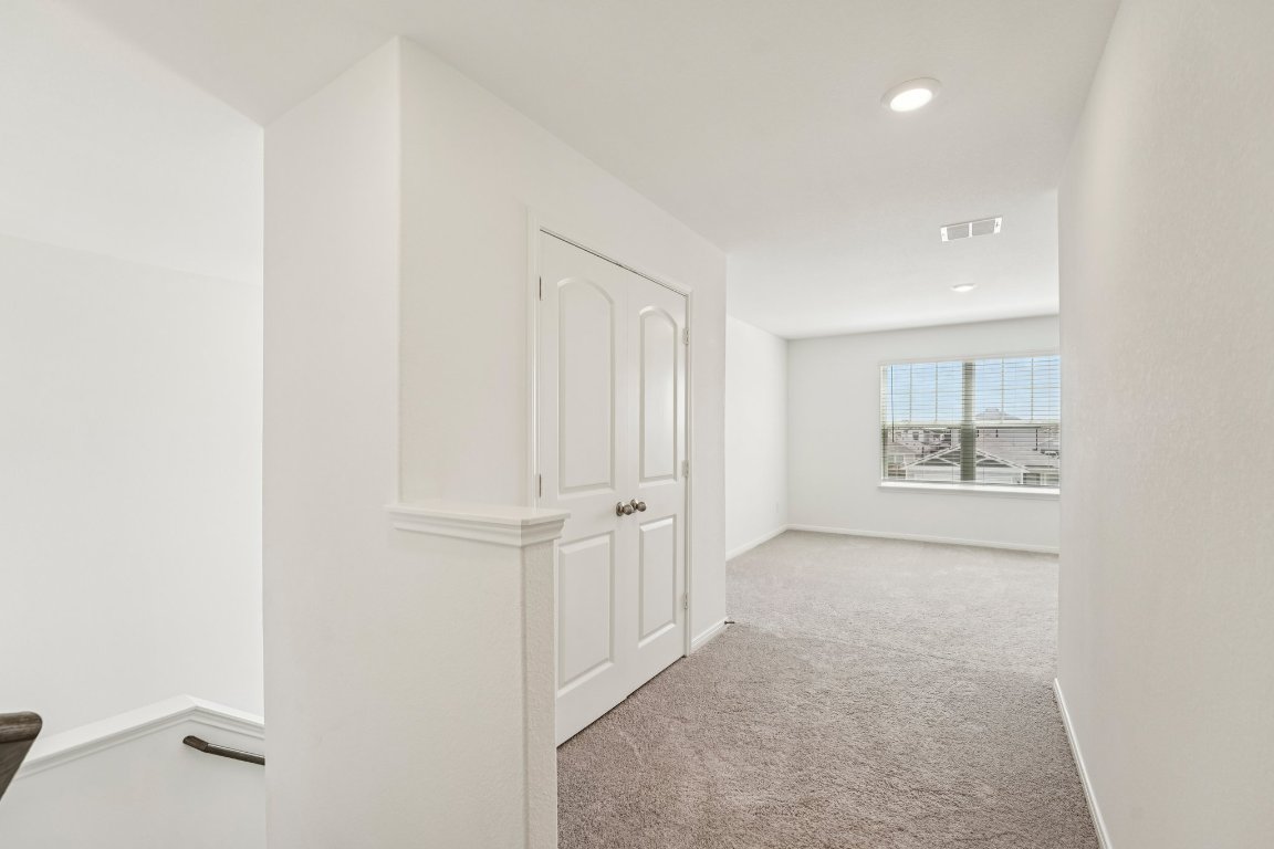 571 Aplite Pass Maxwell, TX 78656 - Photo 23 of 29 an empty room with a bench and cabinet