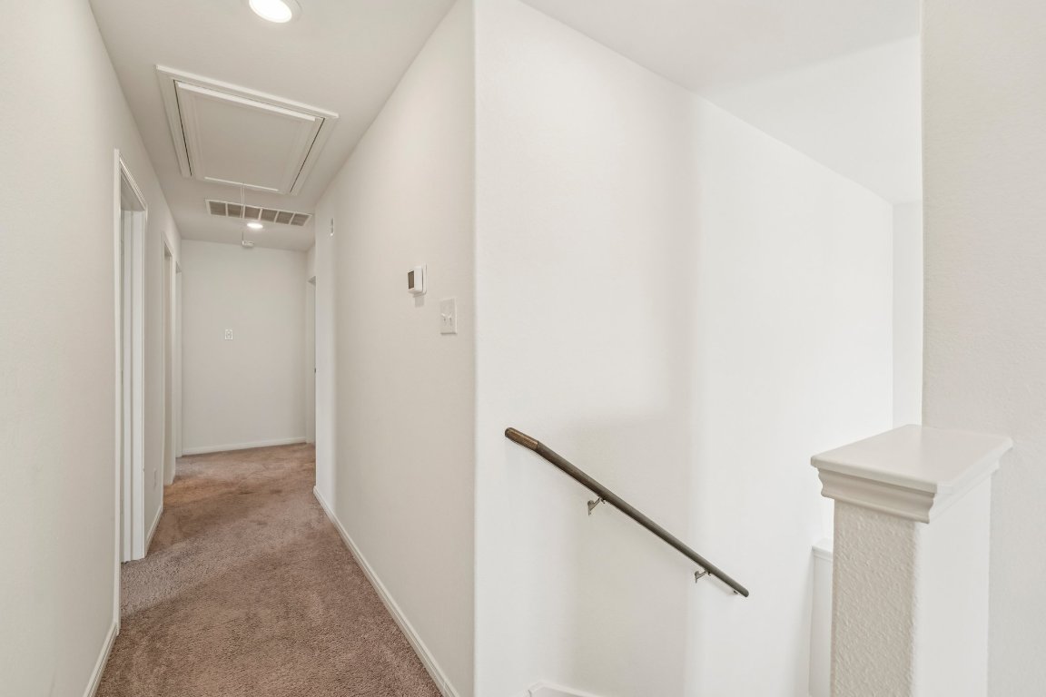 571 Aplite Pass Maxwell, TX 78656 - Photo 26 of 29 a view of a hallway with a white walls