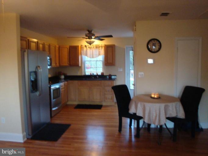 8507 Philadelphia Road Rosedale, MD 21237 - Photo 1 of 14 a view of a dining room with furniture and chandelier