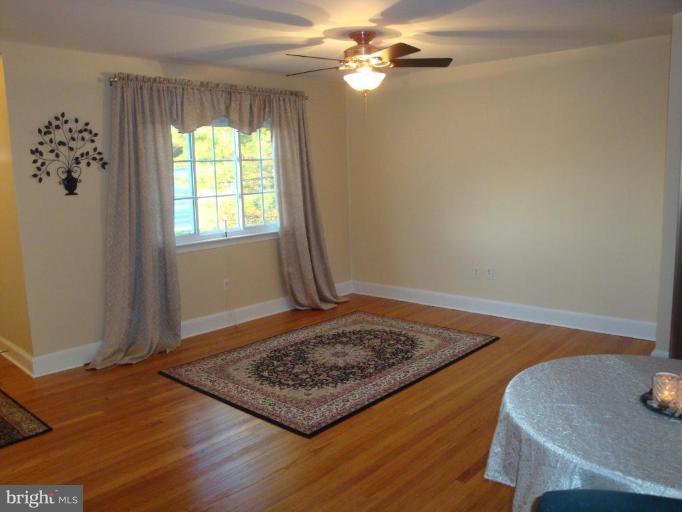 8507 Philadelphia Road Rosedale, MD 21237 - Photo 11 of 14 a view of a room with wooden floor and a window