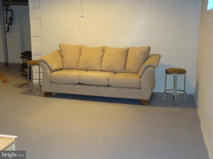 8507 Philadelphia Road Rosedale, MD 21237 - Photo 12 of 14 a living room with furniture and a couch