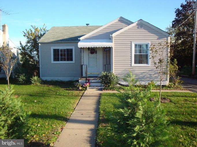 8507 Philadelphia Road Rosedale, MD 21237 - Photo 13 of 14 a front view of a house with a yard