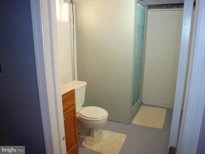 8507 Philadelphia Road Rosedale, MD 21237 - Photo 5 of 14 a white toilet sitting next to a shower
