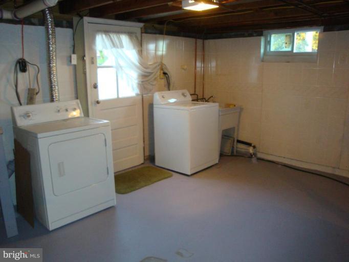 8507 Philadelphia Road Rosedale, MD 21237 - Photo 6 of 14 a utility room with dryer and washer
