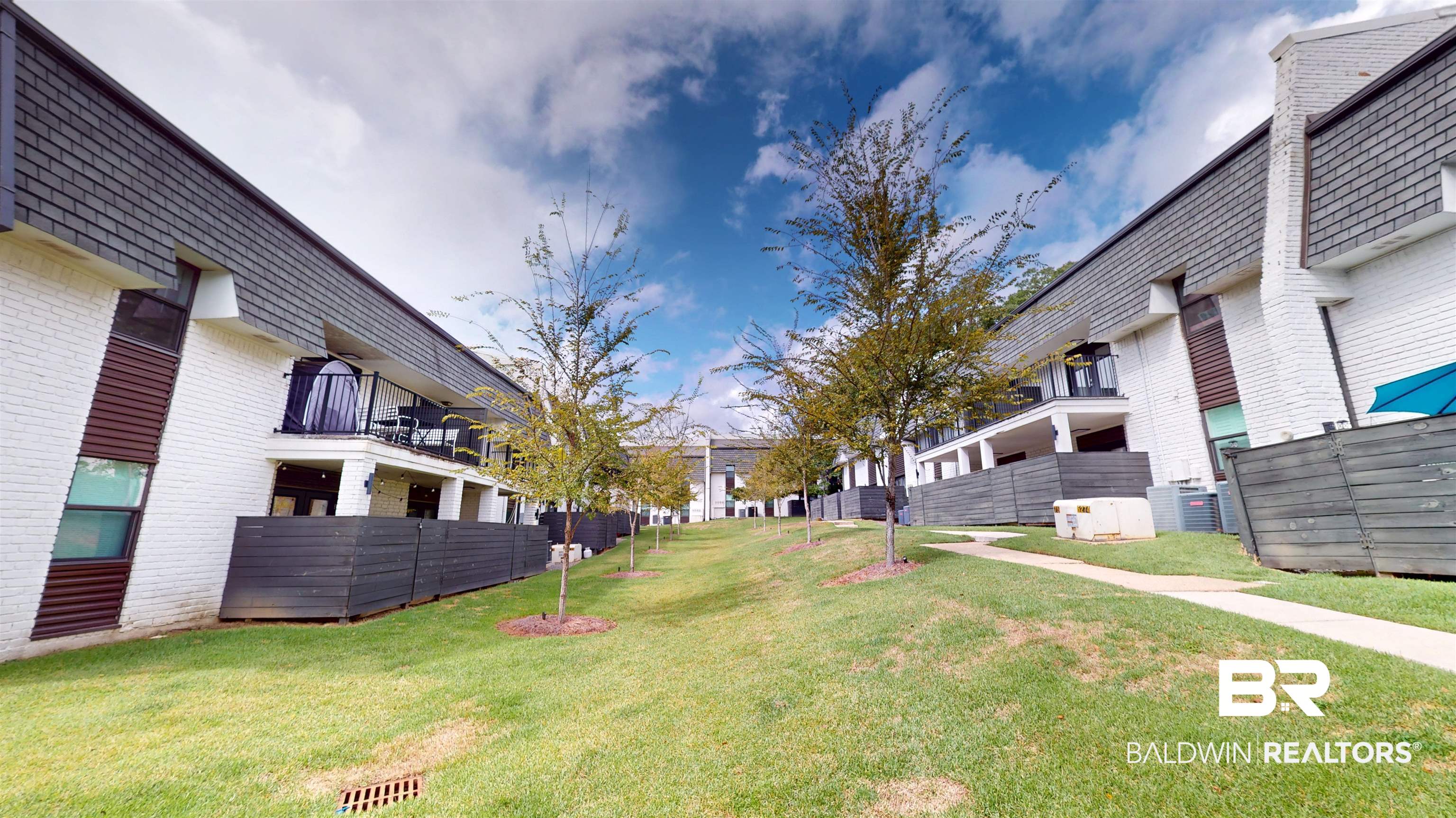3655 Old Shell Road, Unit 219 Mobile, AL 36608 - Photo 22 of 25 View of green lawn with a balcony