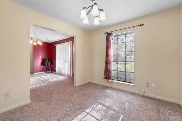 a view of a room with large windows