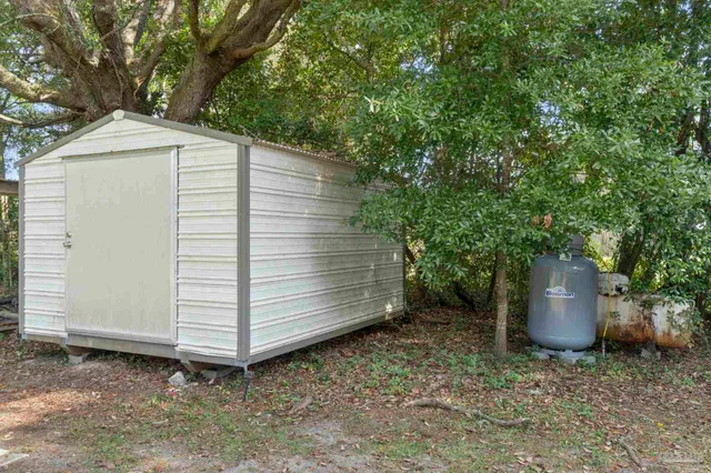a backyard of a house with a garden and entertaining space