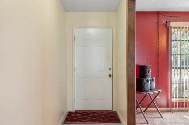 a bathroom with a shower and a mirror