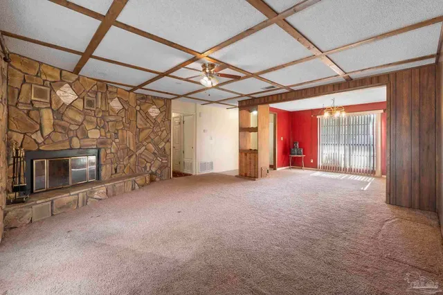 a view of empty room with fireplace