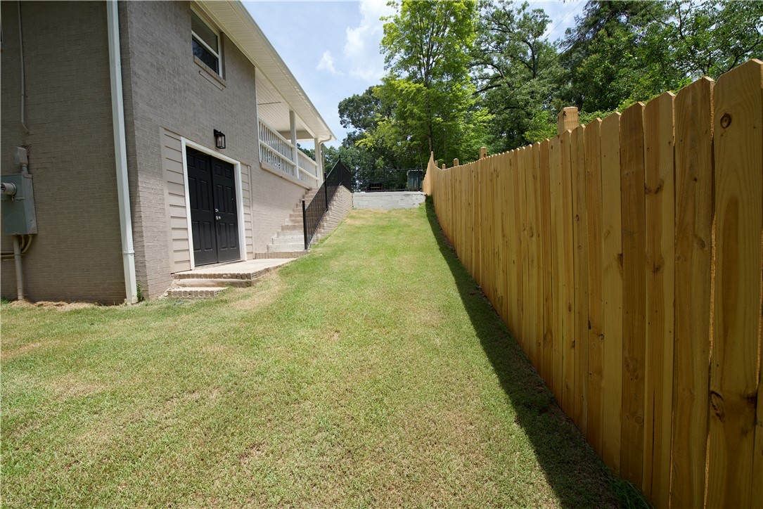 317 Pendleton Road Clemson, SC 29631 - Photo 10 of 36 Secure yard space with a new wooden privacy fence and a rear walk-out basement entrance.