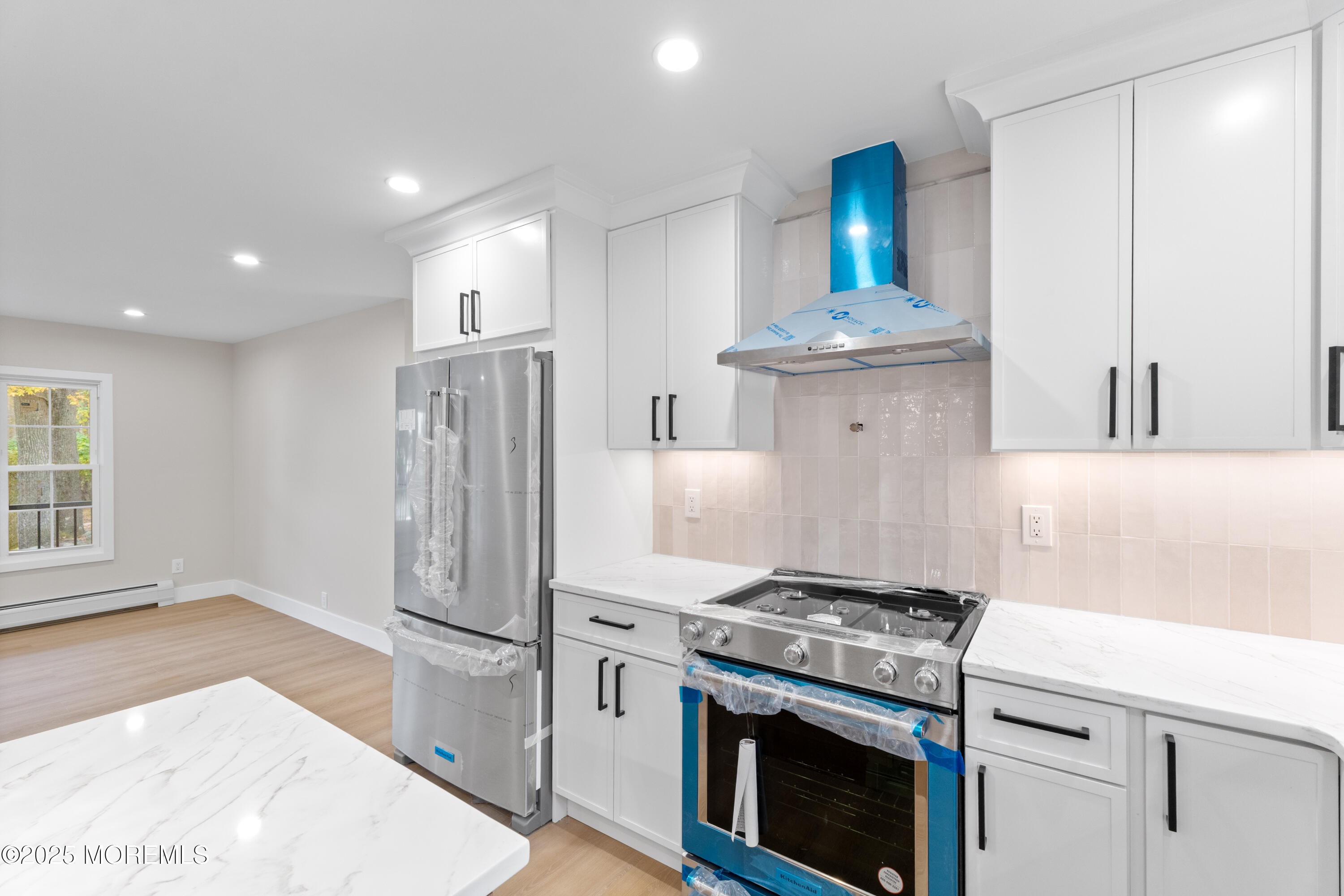 75 Ohio Avenue Middletown, NJ 07758 - Photo 15 of 40 a kitchen with a stove and a refrigerator
