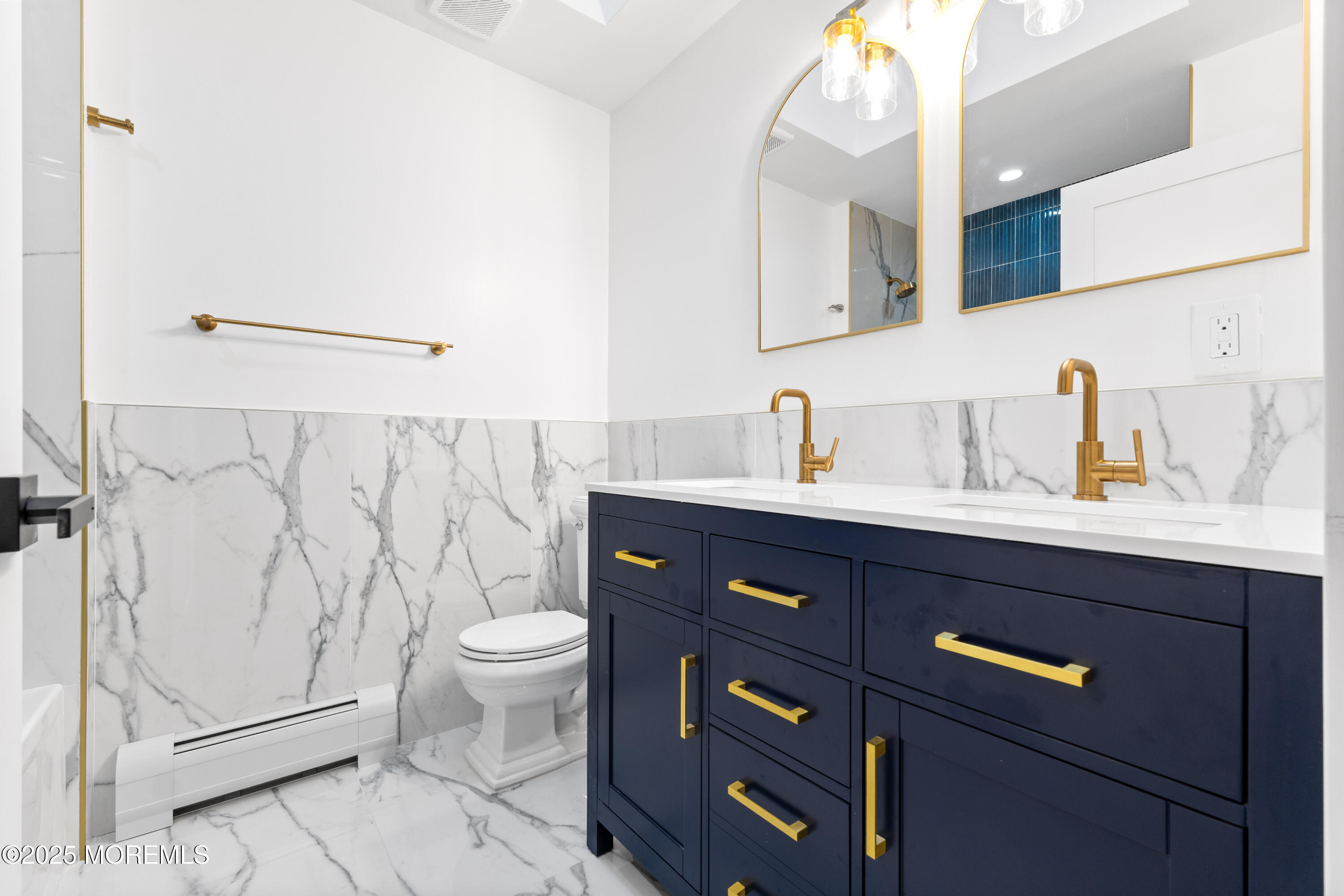 75 Ohio Avenue Middletown, NJ 07758 - Photo 22 of 40 a bathroom with a sink a toilet and shower