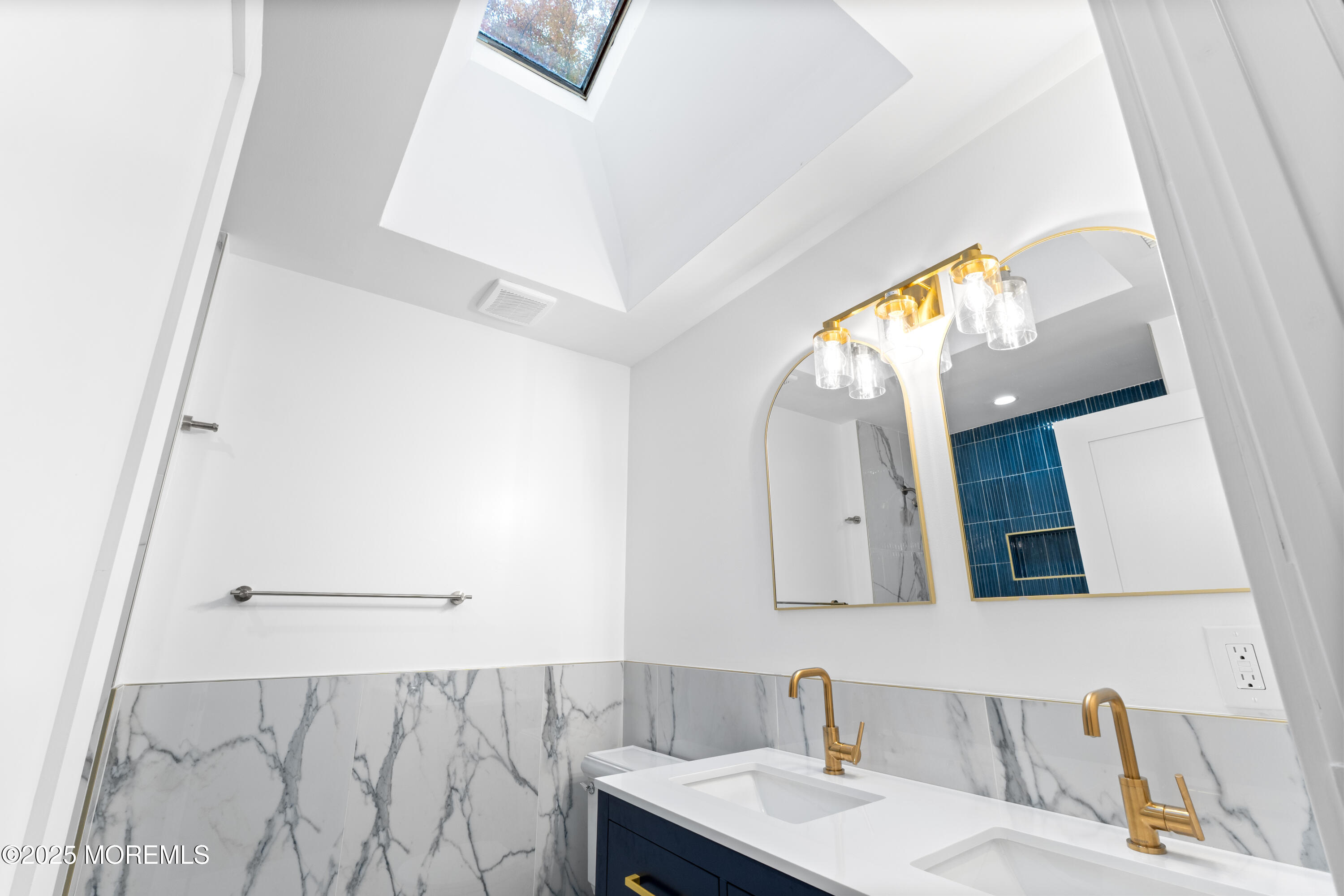 75 Ohio Avenue Middletown, NJ 07758 - Photo 24 of 40 a bathroom with a sink and a mirror