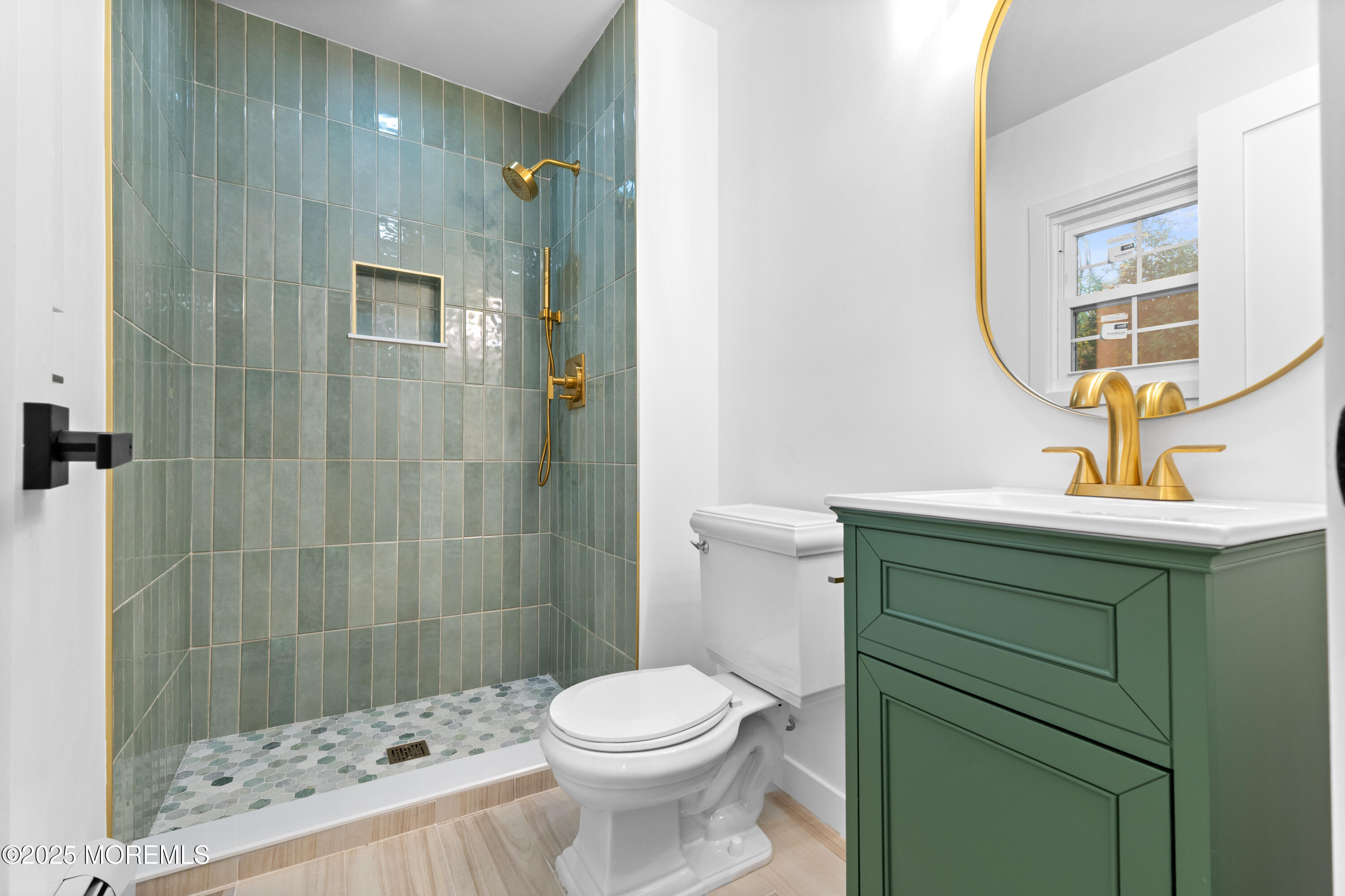 75 Ohio Avenue Middletown, NJ 07758 - Photo 29 of 40 a bathroom with a sink toilet and shower