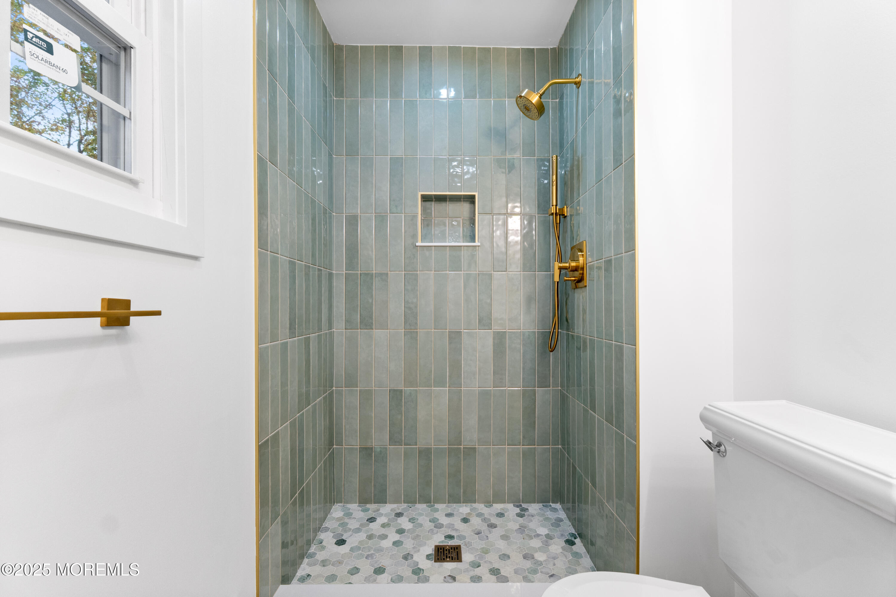 75 Ohio Avenue Middletown, NJ 07758 - Photo 30 of 40 a bathroom with a shower and a toilet