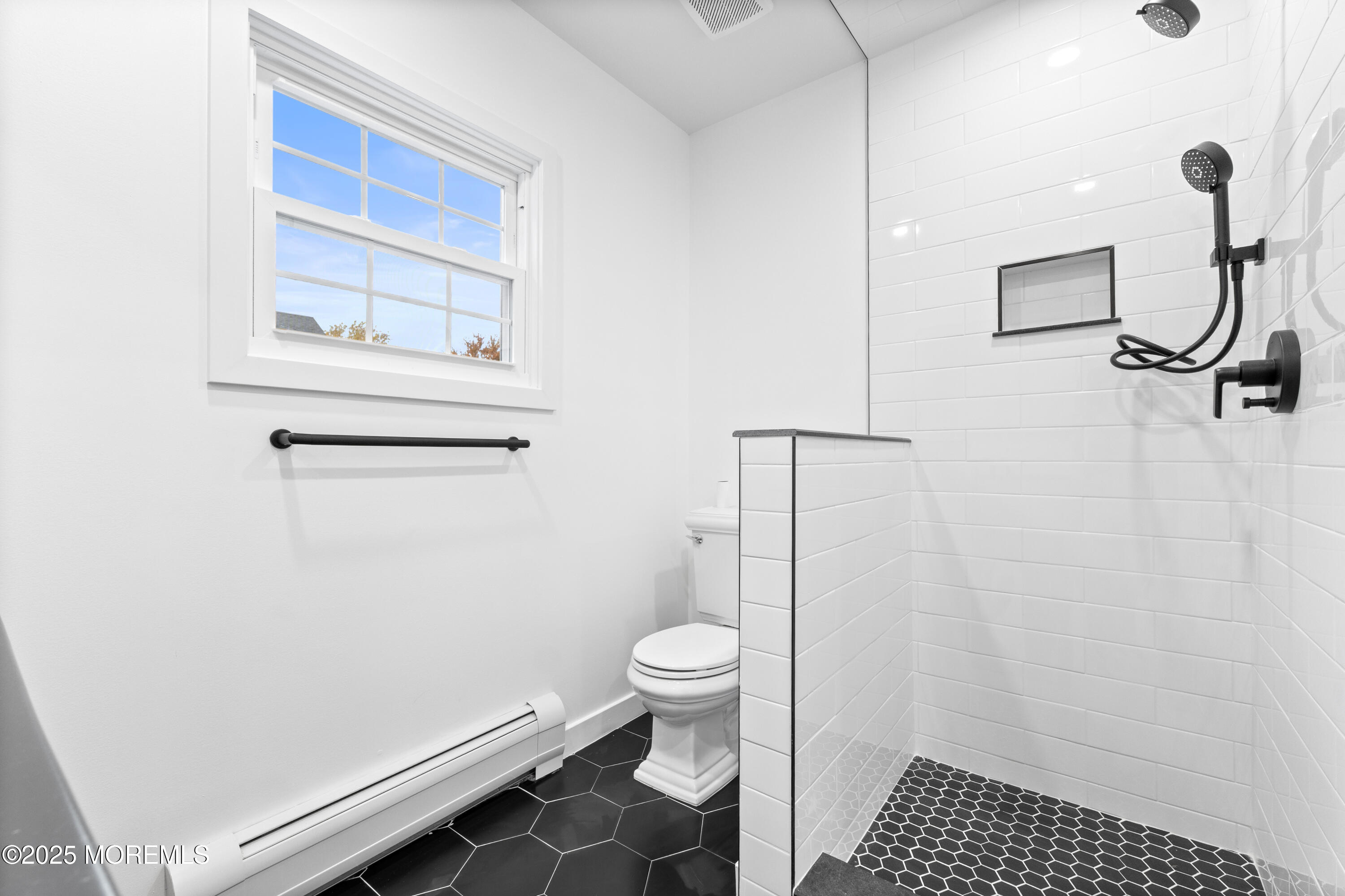 75 Ohio Avenue Middletown, NJ 07758 - Photo 37 of 40 a bathroom with a toilet and a shower