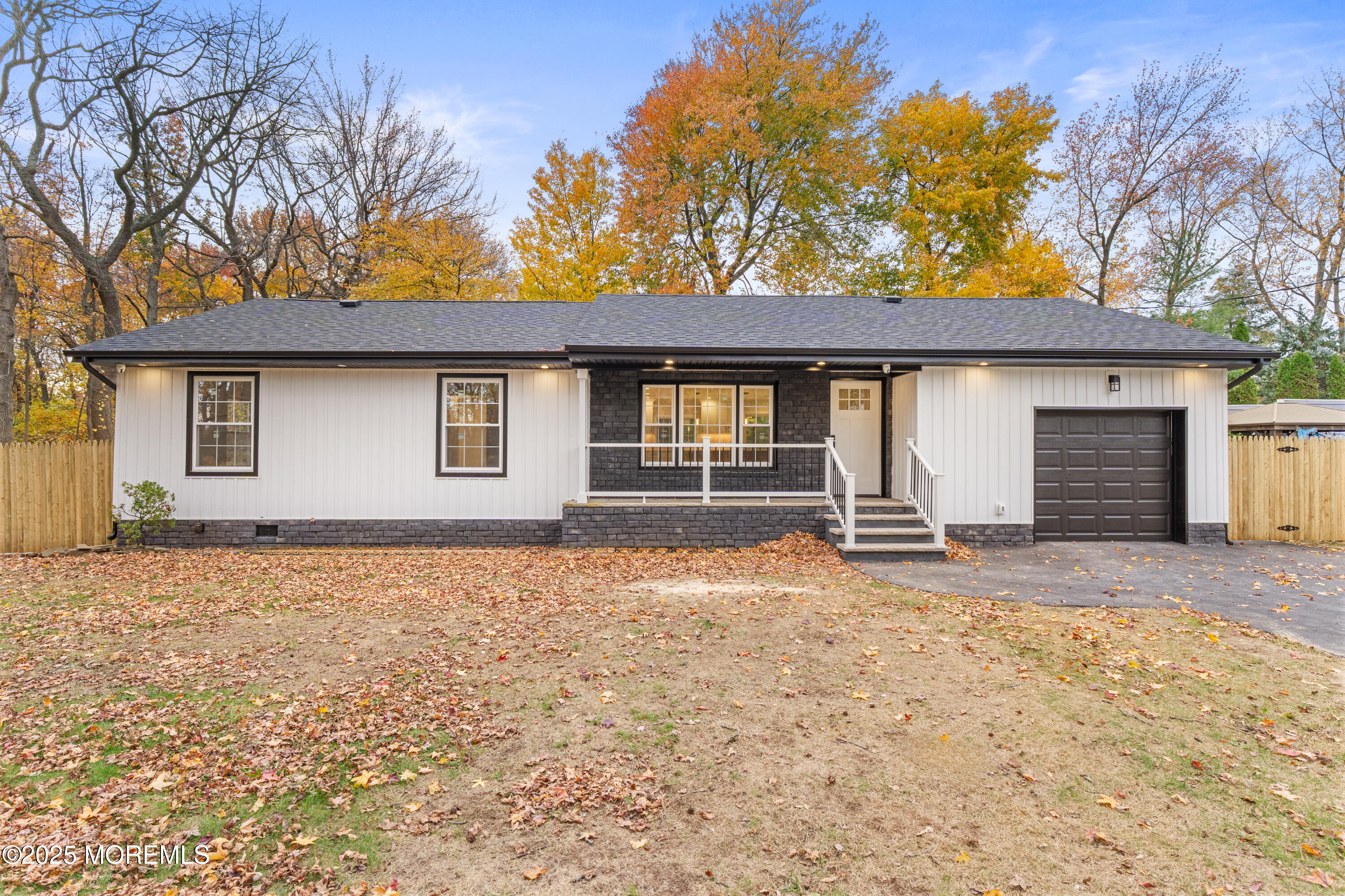 75 Ohio Avenue Middletown, NJ 07758 - Photo 4 of 40 a house with trees in the background