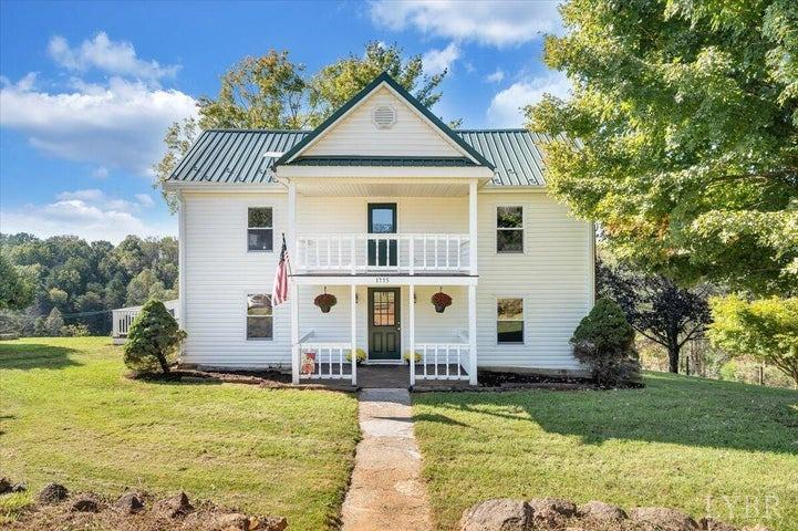 1775 Dickerson Road Goodview, VA 24095 - Photo 1 of 24 a front view of house with yard and trees in the background