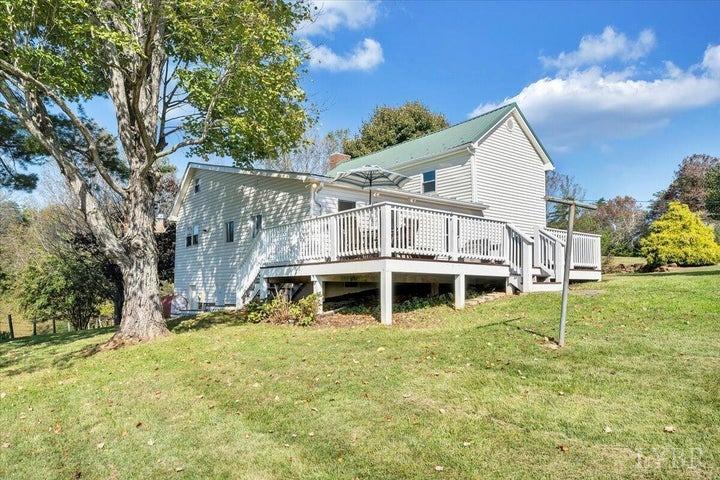 1775 Dickerson Road Goodview, VA 24095 - Photo 15 of 24 a view of a house with a yard balcony and wooden fence
