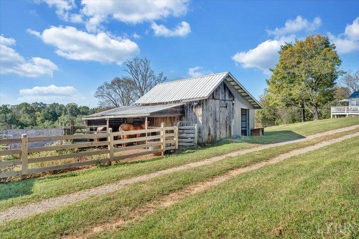 1775 Dickerson Road Goodview, VA 24095 - Photo 21 of 24 a view of a house with a yard and sitting area