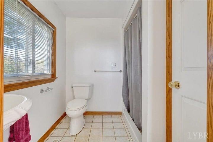 1775 Dickerson Road Goodview, VA 24095 - Photo 10 of 24 a bathroom with a toilet and a shower